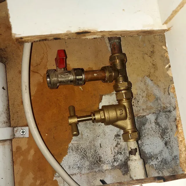 A new brass stop tap and isolating valve on a water pipe